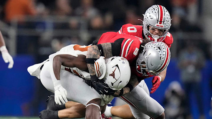 Ohio State Buckeyes safety Lathan Ransom (8) tackles Texas Longhorns running back Quintrevion Wisner (26) in the third quarter of the Cotton Bowl Classic during the College Football Playoff semifinal game at AT&T Stadium in Arlington, Texas on January, 10, 2025.