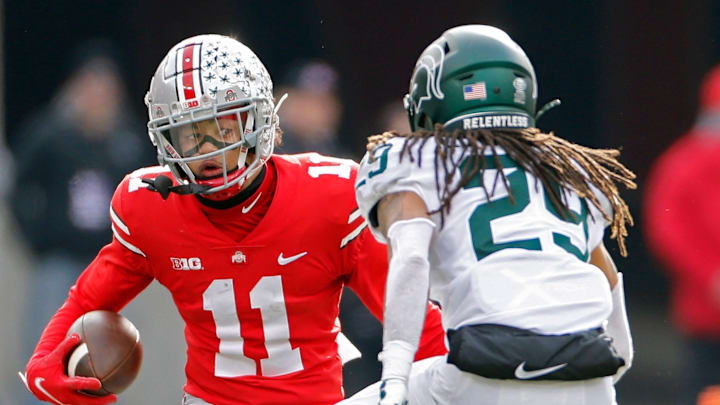 Ohio State Buckeyes wide receiver Jaxon Smith-Njigba (11) tries to get past Michigan State Spartans cornerback Marqui Lowery (29) after a catch in the second quarter during their NCAA College football game at Ohio Stadium in Columbus, Ohio on November 20, 2021.