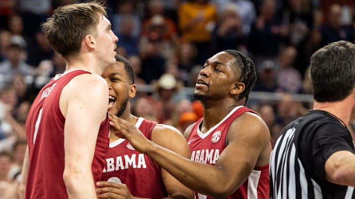 Alabama Crimson Tide forward Grant Nelson (4) celebrates his dunk as Auburn Tigers take on Alabama Crimson Tide at Neville Arena in Auburn, Ala., on Saturday, March 8, 2025. Alabama Crimson Tide lead Auburn Tigers 45-42 at halftime.