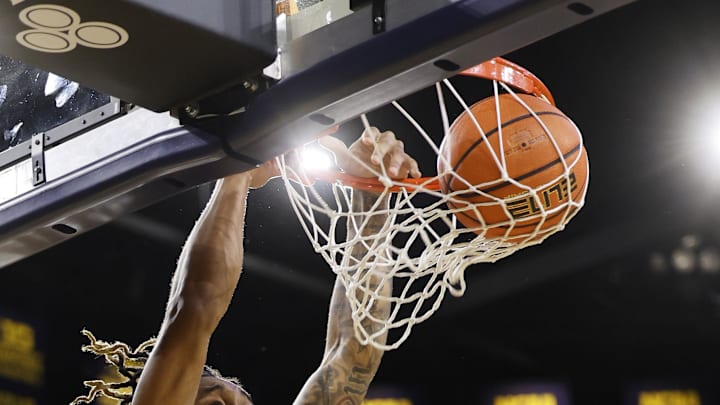 Dec 29, 2023; Ann Arbor, Michigan, USA;  McNeese State Cowboys forward Christian Shumate (24) dunks