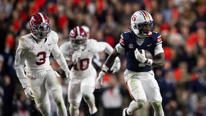 Auburn Tigers wide receiver Eric Singleton Jr. (1) turns up field after a catch as Auburn Tigers take on Alabama Crimson Tide in the Iron Bowl at Jordan-Hare Stadium in Auburn, Ala. on Saturday, Nov. 29, 2025. Alabama Crimson Tide defeated Auburn Tigers 27-20.