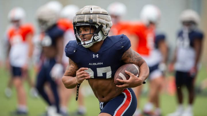 Auburn Tigers running back Jarquez Hunter (27) runs the ball during practice at Woltosz Football Performance Center in Auburn, Ala., on Tuesday, April 2, 2024.
