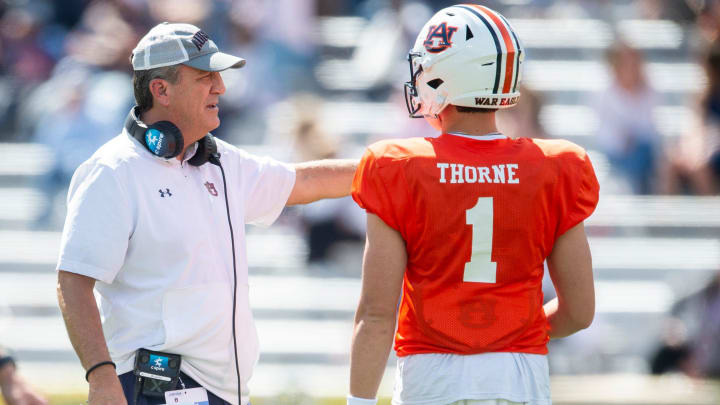 Auburn Tigers quarterbacks coach Kent Austin talks with quarterback Payton Thorne (1) during the A-Day spring game at Jordan-Hare Stadium in Auburn, Ala., on Saturday, April 6, 2024.