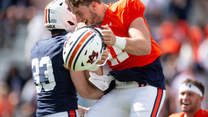 Auburn Tigers kicker Towns McGough (33) and Auburn Tigers quarterback Walker White (11) celebrate McGough’s game winning field goal during the A-Day spring game at Jordan-Hare Stadium in Auburn, Ala., on Saturday, April 6, 2024.