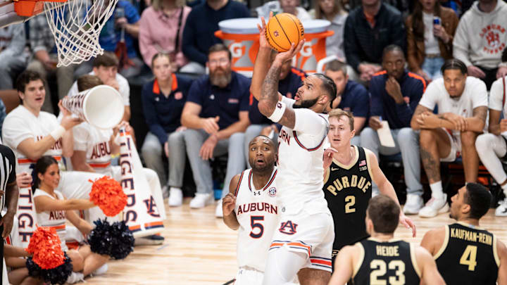 Auburn Tigers forward Johni Broome (4) goes up for a layup as Auburn Tigers take on Purdue Boilermakers at Legacy Arena in Birmingham, Ala., on Saturday, Dec. 21, 2024. Auburn Tigers defeated Purdue Boilermakers 87-69.