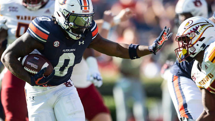 Auburn Tigers running back Damari Alston (0) runs the ball into the end zone for a touchdown as Auburn Tigers take on Louisiana-Monroe Warhawks at Jordan-Hare Stadium in Auburn, Ala., on Saturday, Nov. 16, 2024. Auburn Tigers defeated Louisiana-Monroe Warhawks 48-14.