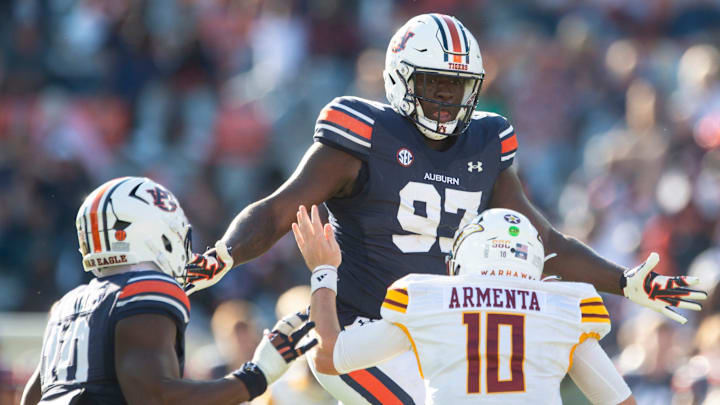 Auburn Tigers defensive lineman Quientrail Jamison-Travis (97) sacks Louisiana-Monroe Warhawks quarterback Aidan Armenta (10) as Auburn Tigers take on Louisiana-Monroe Warhawks at Jordan-Hare Stadium in Auburn, Ala., on Saturday, Nov. 16, 2024. Auburn Tigers defeated Louisiana-Monroe Warhawks 48-14.