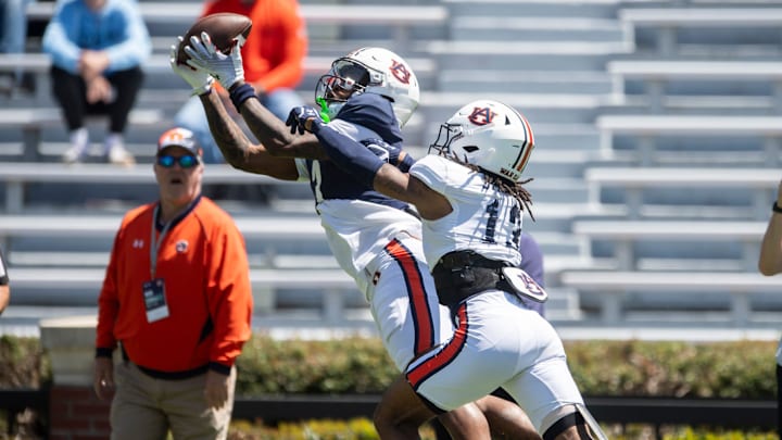 Auburn Tigers wide receiver Perry Thompson (3) catches a pass over Auburn Tigers defensive back Raion Strader (13) during Auburn Tigers A-Day football practice at Jordan-Hare Stadium in Auburn, Ala., on Saturday, April 12, 2025.