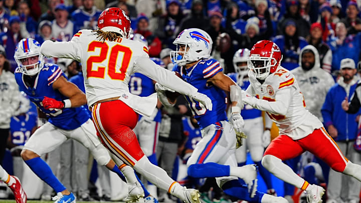 Bills Mack Hollins watches as teammate Khalil Shakir slips between Kansas City's Justine Reid and Nazeeh Johnson for a gain of about five-yards during second half action against the Kansas City Chiefs in Orchard Park, Nov.17, 2024.