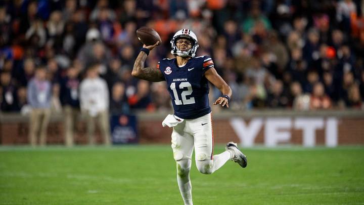 Auburn Tigers quarterback Ashton Daniels (12) pump fakes a pass as Auburn Tigers take on Kentucky Wildcats at Jordan-Hare Stadium in Auburn, Ala. on Saturday, Nov. 1, 2025. Auburn Tigers and Kentucky Wildcats are tied 3-3 at halftime.