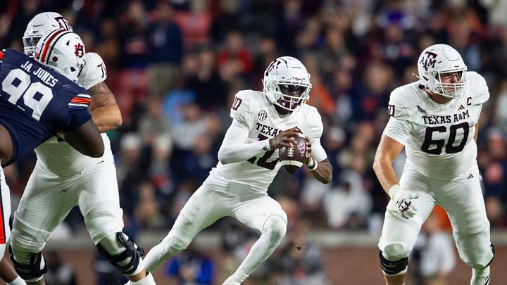 Texas A&M Aggies quarterback Marcel Reed (10) runs the ball as Auburn Tigers take on Texas A&M Aggies at Jordan-Hare Stadium in Auburn, Ala., on Saturday, Nov. 23, 2024. Auburn Tigers lead Texas A&M Aggies 21-7 at halftime.