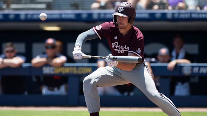 Texas A&M Aggies' Hayden Schott (12) bunts the ball as Auburn Tigers take on Texas A&M Aggies during the SEC baseball tournament at Hoover Met in Birmingham, Ala., on Thursday, May 22, 2025.