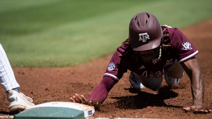 Texas A&M Aggies' Terrence Kiel II (3) dives safely into first base as Auburn Tigers take on Texas A&M Aggies during the SEC baseball tournament at Hoover Met in Birmingham, Ala., on Thursday, May 22, 2025. Texas A&M Aggies' Terrence Kiel II (3) dives safely into first base as Auburn Tigers take on Texas A&M Aggies during the SEC baseball tournament at Hoover Met in Birmingham, Ala., on Thursday, May 22, 2025.
