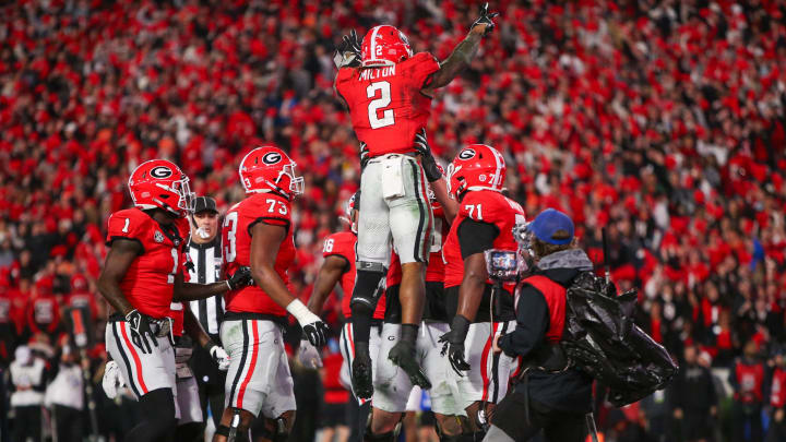 Nov 11, 2023; Athens, Georgia, USA; Georgia Bulldogs running back Kendall Milton (2) celebrates with teammates after a touchdown against the Mississippi Rebels in the second quarter at Sanford Stadium. Mandatory Credit: Brett Davis-USA TODAY Sports
