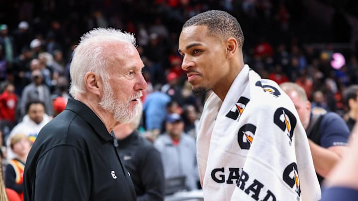 Feb 11, 2023; Atlanta, Georgia, USA; San Antonio Spurs head coach Gregg Popovich talks to Atlanta Hawks guard Dejounte Murray (5) after a game at State Farm Arena. Mandatory Credit: Brett Davis-Imagn Images