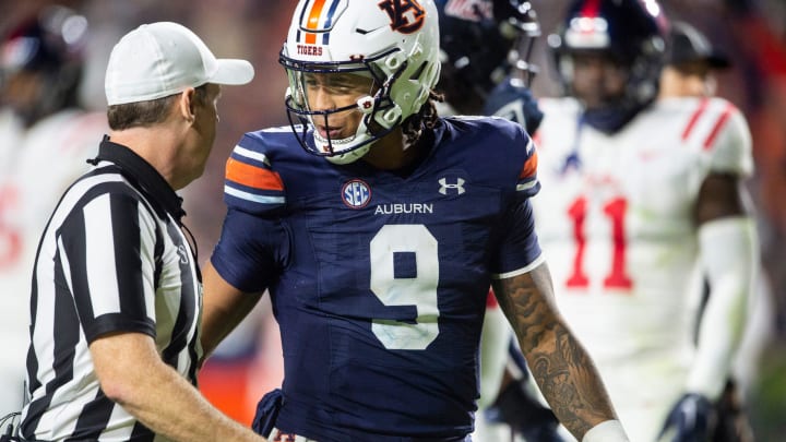 Auburn Tigers quarterback Robby Ashford (9) talks with the official after a penalty as Auburn Tigers take on Mississippi Rebels at Jordan-Hare Stadium in Auburn, Ala., on Saturday, Oct. 21, 2023.