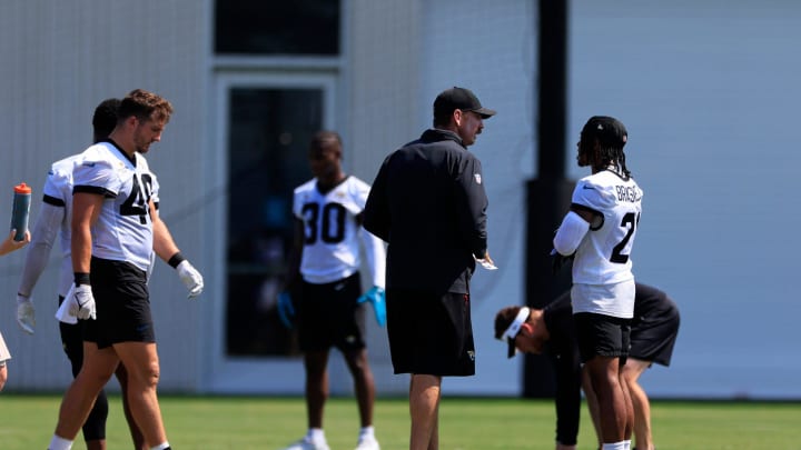 Jacksonville Jaguars defensive coordinator Ryan Nielsen talks with cornerback Christian Braswell (21) during an organized team activity Tuesday, May 28, 2024 at EverBank Stadium’s Miller Electric Center in Jacksonville, Fla.