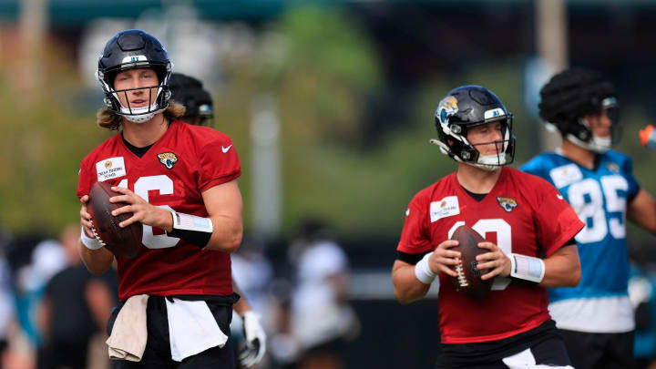 Jacksonville Jaguars quarterback Trevor Lawrence (16) and quarterback Mac Jones (10) look to pass during the third day of an NFL football training camp practice Friday, July 26, 2024 at EverBank Stadium’s Miller Electric Center in Jacksonville, Fla.