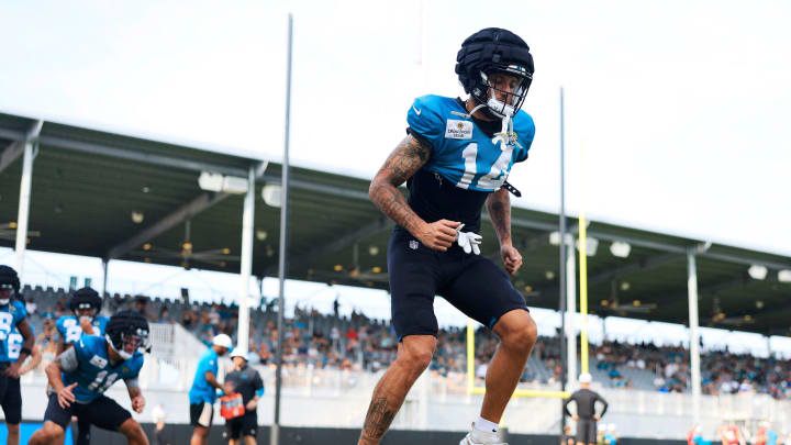 Jacksonville Jaguars wide receiver Elijah Cooks (14) performs ladder drills during the seventh day of an NFL football training camp practice Wednesday, July 31, 2024 at EverBank Stadium’s Miller Electric Center in Jacksonville, Fla.