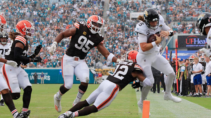 Jacksonville Jaguars quarterback Trevor Lawrence (16) is shoved out of bounds shy of the goal line by Cleveland Browns safety Rodney McLeod Jr. (12) during the second quarter of an NFL football matchup Sunday, Sept. 15, 2024 at EverBank Stadium in Jacksonville, Fla. [Corey Perrine/Florida Times-Union]