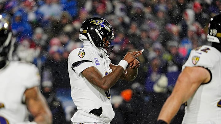 Baltimore Ravens quarterback Lamar Jackson checks his wrist for a play during first half action at the Buffalo Bills divisional game against the Baltimore Ravens at Highmark Stadium in Orchard Park on Jan. 19, 2025.