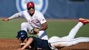 Arkansas Razorbacks' Wehiwa Aloy (9) tags out Ole Miss Rebels' Judd Utermark (27) at second base as Arkansas Razorbacks take on Ole Miss Rebels during the SEC baseball tournament at Hoover Met in Birmingham, Ala., on Friday, May 23, 2025. Ole Miss Rebels defeated Arkansas Razorbacks 5-2.