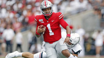 Ohio State Buckeyes quarterback Justin Fields (1) shakes off Cincinnati Bearcats linebacker Joel Dublanko (41) during the 1st quarter of their game at Ohio Stadium on September 7, 2019.