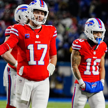 Buffalo Bills RB James Cook and QB Josh Allen  fist bump after a play during second half action at Highmark Stadium.