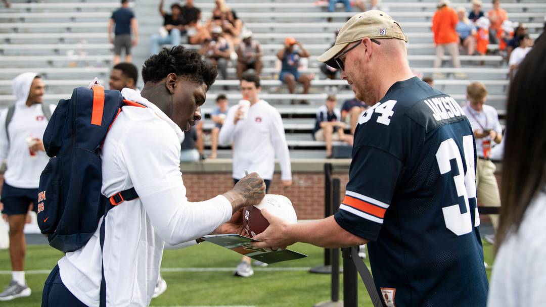 Auburn Tigers linebacker Xavier Atkins (17) signs an autograph after Auburn Tigers A-Day spring game at Jordan-Hare Stadium in Auburn, Ala. on Saturday, April 18, 2026.
