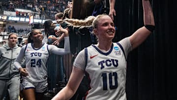 TCU Horned Frogs guard Hailey Van Lith celebrates with fans as she heads to the locker room after winning against Notre Dame.