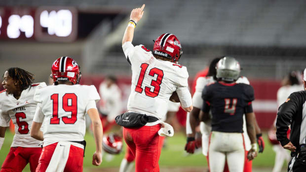 Central Phenix City's Andrew Alford (13) celebrates with his team as Central Phenix City faces Thompson in the Class 7A footb