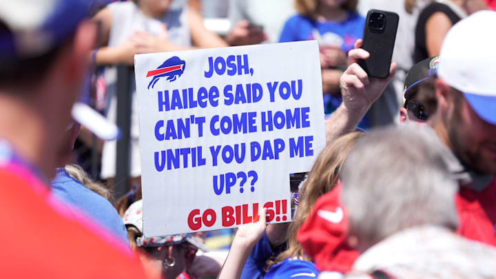 A fan raises a sign trying to get the attention of Buffalo Bills quarterback Josh Allen.
