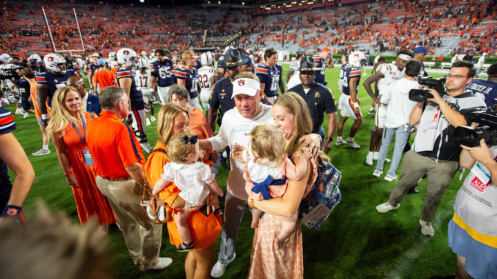 Auburn Tigers head coach Hugh Freeze greets his family after getting the program the 800th win in its history.