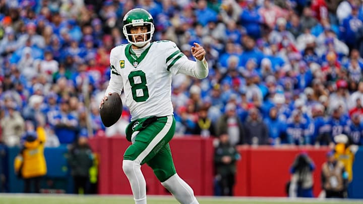New York Jets quarterback Aaron Rodgers (8) breaks away on a fake hand-off looking for an open receiver during first half action at the Bills home game against the New York Jets at Highmark Stadium in Orchard Park on Dec. 29, 2024. His pass was incomplete. New York Jets quarterback Aaron Rodgers (8) breaks away on a fake hand-off looking for an open receiver during first half action at the Bills home game against the New York Jets at Highmark Stadium in Orchard Park on Dec. 29, 2024. His pass was incomplete.