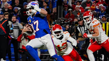 Bills quarterback Josh Allen avoids Kansas City's Nazeeh Johnson and Drue Tranquill on his late fourth quarter touchdown carry into the end zone.