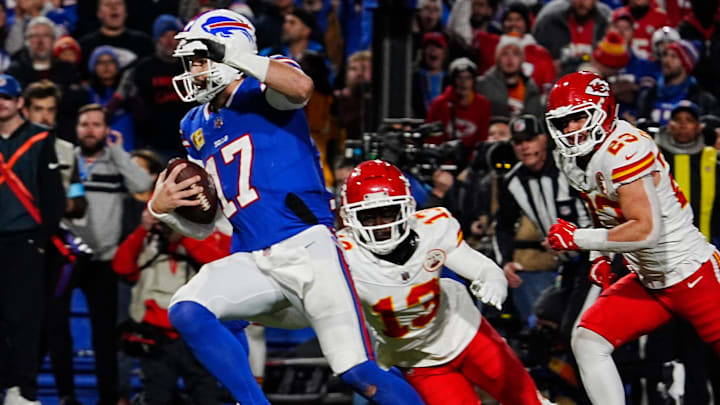Bills quarterback Josh Allen avoids Kansas City's Nazeeh Johnson and Drue Tranquill on his late fourth quarter touchdown carry into the end zone.