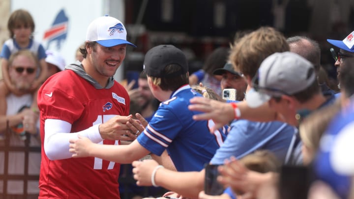 Bills Quarterback Josh Allen gives high-fives to fans as he circles the stadium at the end of Bills training camp at St. John Fisher University in Pittsford, NY on August 8, 2024. Today was the last day at St. John Fisher.