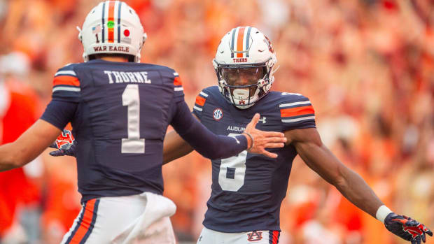 Auburn quarterback Payton Thorne and Cam Coleman celebrate their touchdown.