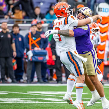Ta'ita'i Uiagalelei got to the quarterback a tad late for a sack and to prevent the pass, and then drew a UW roughing call. 