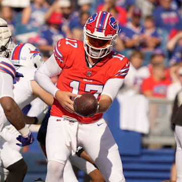 Buffalo Bills quarterback Josh Allen hands the ball off to running back James Cook during the Return of the Blue & Red practice at Highmark Stadium in Orchard Park on Aug.1, 2025.