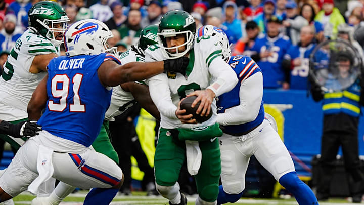 New York Jets quarterback Aaron Rodgers (8) gets sacked by Buffalo Bills defensive tackle Ed Oliver (91) and Buffalo Bills linebacker Von Miller (40) New York Jets quarterback Aaron Rodgers (8) gets sacked by Buffalo Bills defensive tackle Ed Oliver (91) and Buffalo Bills linebacker Von Miller (40)