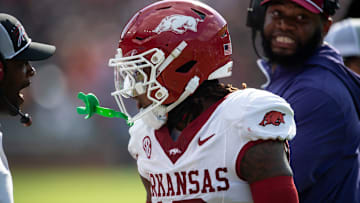 Arkansas Razorbacks defensive back TJ Metcalf (18) celebrates his forced fumble as Auburn Tigers take on Arkansas Razorbacks at Jordan-Hare Stadium in Auburn, Ala., on Saturday, Sept. 21, 2024. Arkansas Razorbacks lead Auburn Tigers 7-0 at halftime.