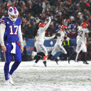 Buffalo Bills quarterback Josh Allen walks off the field after throwing an interception late in the