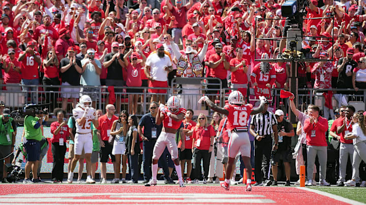 Ohio State Buckeyes cornerback Davison Igbinosun celebrates breaking up a pass for Texas Longhorns receiver Parker Livingstone Ohio State Buckeyes cornerback Davison Igbinosun celebrates breaking up a pass for Texas Longhorns receiver Parker Livingstone