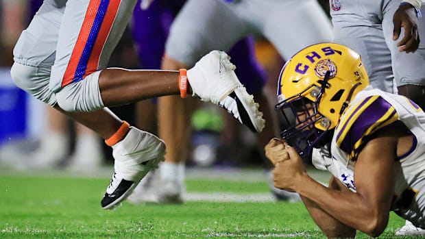 Columbia's Timothy Smith (32) makes a shoe-string tackle on Bolles' Santana Starks (8) during the fourth quarter of a high sc
