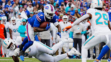Bills James Cook avoids Miami's Calais Campbell's tackle during second half action at Highmark Stadium on Nov. 3, 2024.