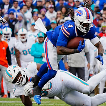 Bills James Cook avoids Miami's Calais Campbell's tackle during second half action at Highmark Stadium on Nov. 3, 2024.