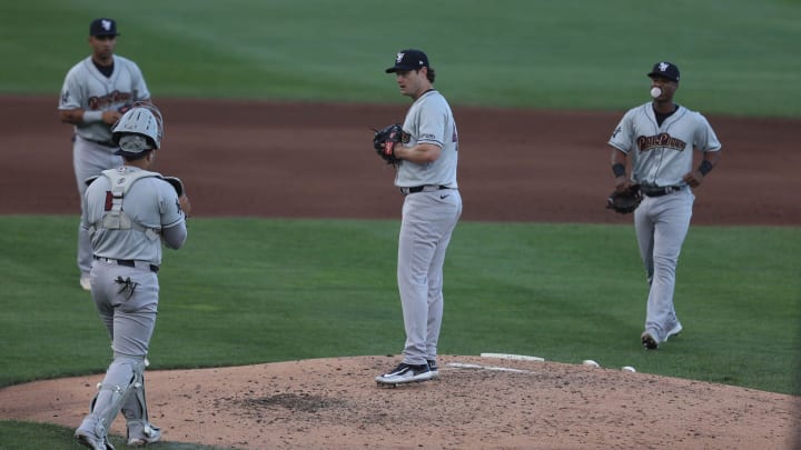 The infield heads to the pitchers mound as Gerrit Cole, rehabbing with Scranton Wilkes RailRiders, gets pulled from the game.