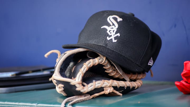 Jul 15, 2023; Atlanta, Georgia, USA; A detailed view of a Chicago White Sox hat and glove in the dugout against the Atlanta Braves in the first inning at Truist Park. Mandatory Credit: Brett Davis-Imagn Images