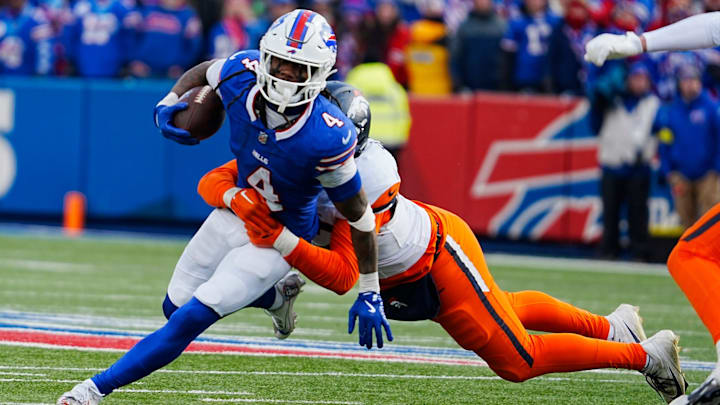 Buffalo Bills running back James Cook (4) gets taken down by Denver Broncos linebacker Dondrea Tillman (92) during the second half of the Buffalo Bills wild card game against the Denver Broncos at Highmark Stadium in Orchard Park on Jan. 12, 2025. Buffalo Bills running back James Cook (4) gets taken down by Denver Broncos linebacker Dondrea Tillman (92) during the second half of the Buffalo Bills wild card game against the Denver Broncos at Highmark Stadium in Orchard Park on Jan. 12, 2025.
